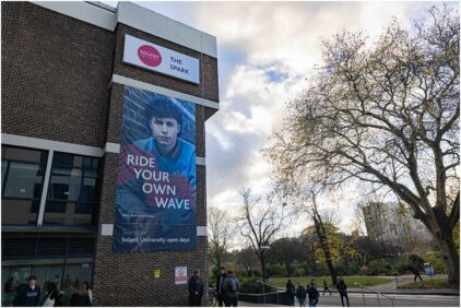 Outdoor image of Solent University's building with a large banner reading 